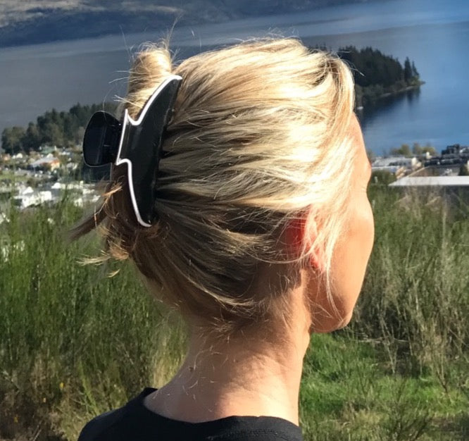 Premium oversized hair claw in black with white edge