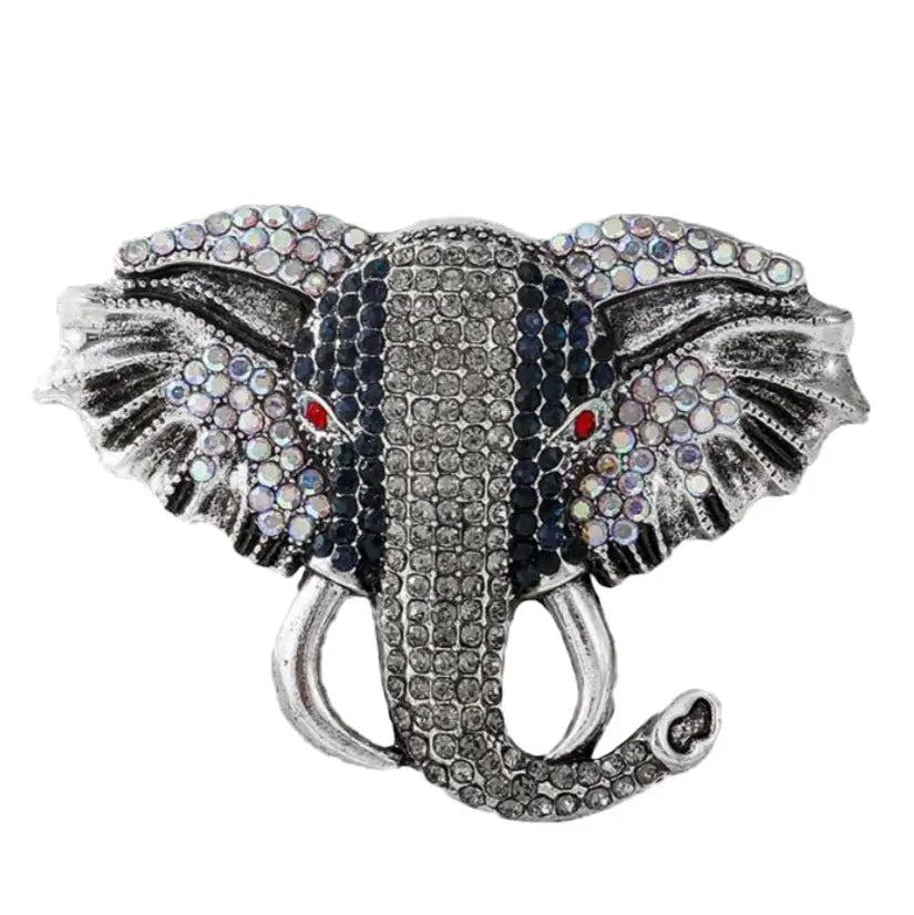 Decorative elephant head with gemstones on a white background