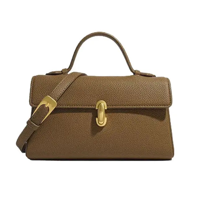 Brown leather handbag with gold hardware on a white background
