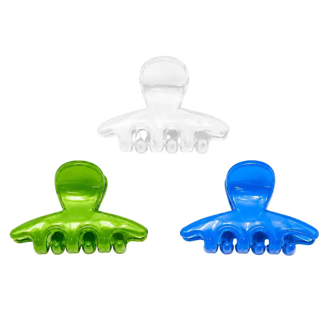 Two green and blue hair clips on a white background with 'JUNO' branding.