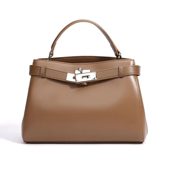 Brown handbag with a silver clasp on a white background