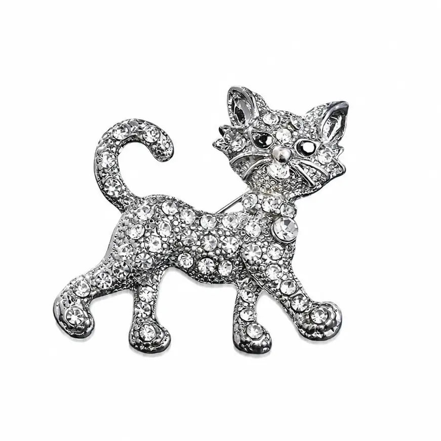 Cat-shaped brooch with crystal embellishments on a white background