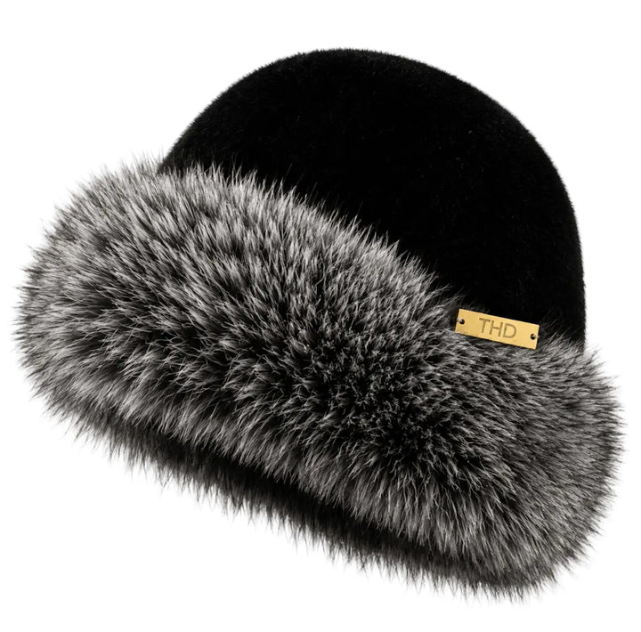Black beanie with gray fur trim on a white background