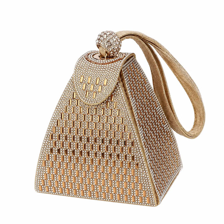 Gold handbag with diamond-like embellishments on a white background