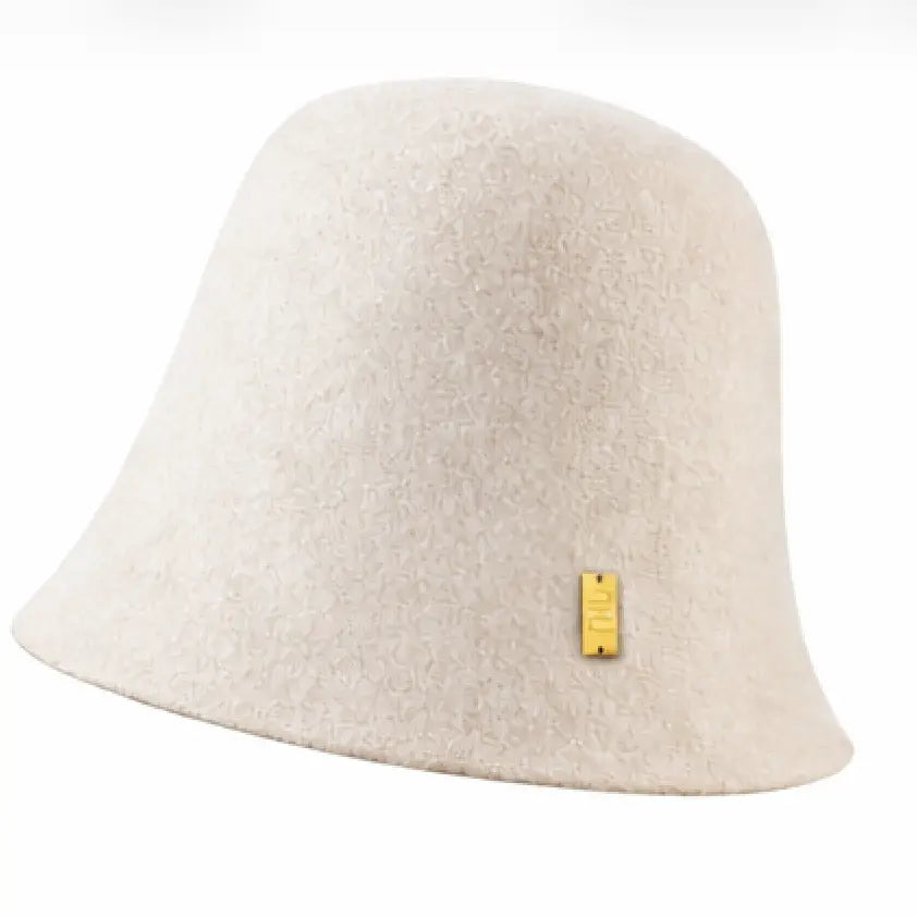Beige bucket hat with a yellow tag on a white background