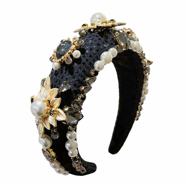 Decorative headband with pearls and gold accents on a white background